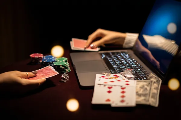 A player using their smartphone during a festive local event, representing 3777 BED’s fully mobile-friendly casino.